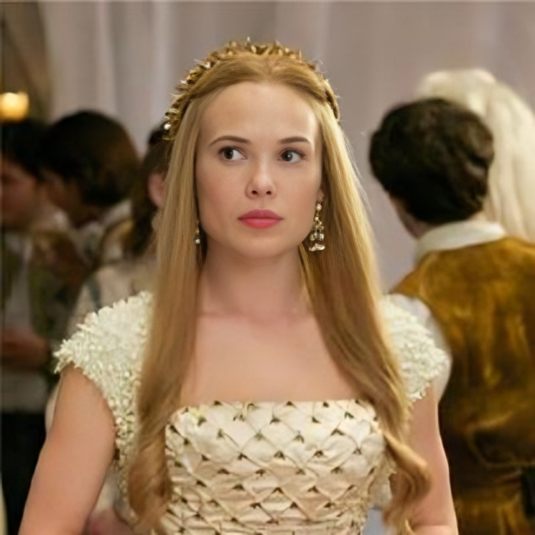 Celina Sinden wearing a white dress in the series "Reign."